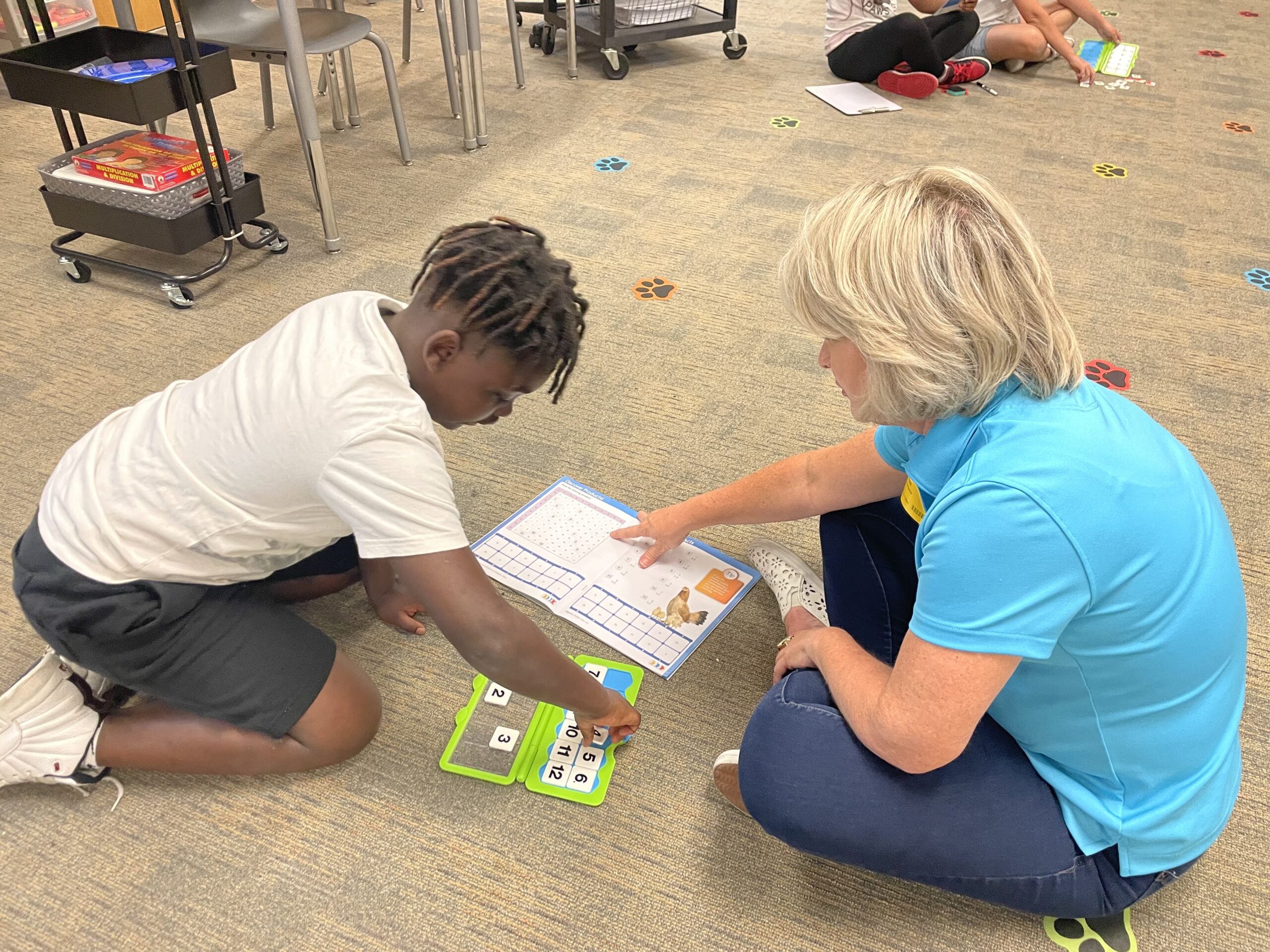 Crookshank Elementary School student demonstrates the VersaTiles math system. Student demonstrates VersaTiles Math tools.