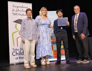 Sherry and Peyton Davidson with Take Stock graduate Jaydin Dang and Mr. Tim Forson. Jaydin received the Jim Davidson Super Senior Scholarship.