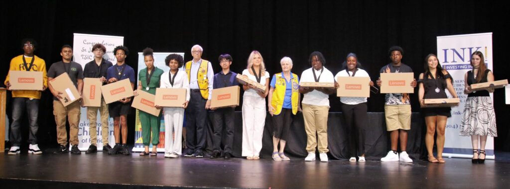 Take Stock in Children graduates receive new laptops from the St. Augustine Lions Club.